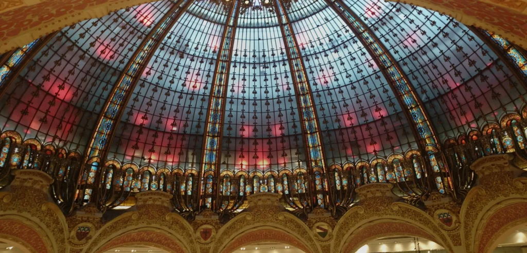 Interior of Galeries Lafayette in Paris, used as contextual luxury-retail imagery for an analysis of the uneven 2026 luxury-market recovery.