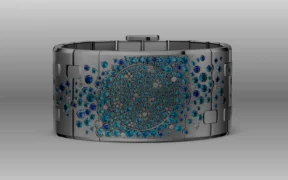 A white-gold cuff set with diamonds and deep-blue gemstones.